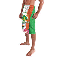 Green kente-pattern lavalava with multicolor coat-of-arms panel, bird and flowers print
