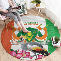 Round carpet rug with Niger coat-of-arms, crane bird, green and orange geometric pattern