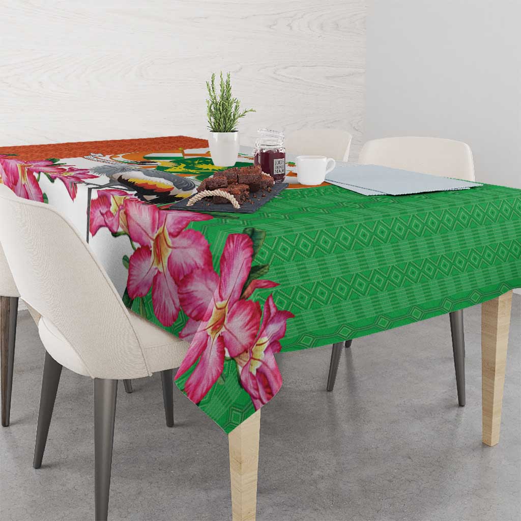Green tablecloth with pink flower print and white sections near the corner drape