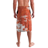 Men's orange football shorts with white splatter, elastic waistband, back view