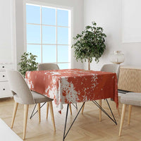 Orange football tablecloth with white splatter pattern draped over rectangular table