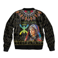 Black bomber jacket with large portrait print and green/gold Amazigh motifs