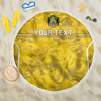 Yellow round beach blanket with white fringe, camouflage print and lion graphic