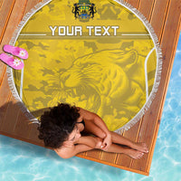Yellow round beach blanket with white fringe, camouflage print and lion graphic