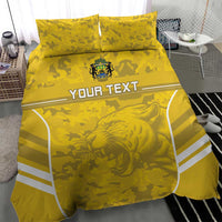Yellow football bedding set featuring lion graphic, camouflage print, white stripe corners