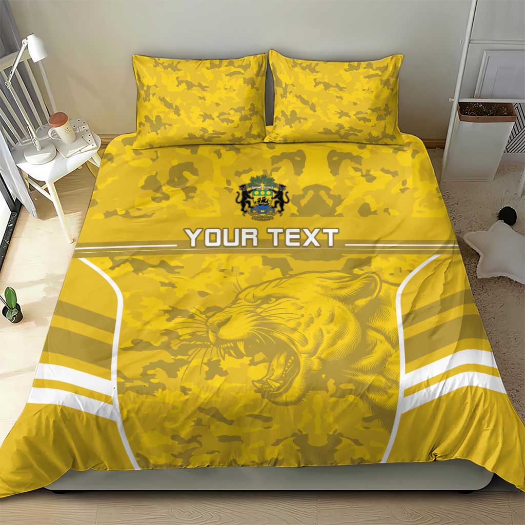 Yellow football bedding set with lion emblem center, camo background, two zip pillows