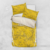 Yellow football bedding set with lion graphic on duvet and two pillowcases, camo print
