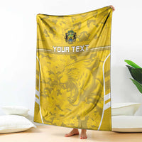 Custom yellow football blanket hanging with crest, lion graphic, and 'YOUR TEXT' text
