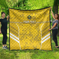 Yellow football quilt with white field shapes and custom text, quilted fabric with crest emblem