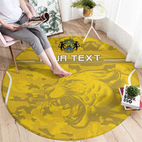 Round yellow football rug with 'YOUR TEXT' and lion crest, placed on floor
