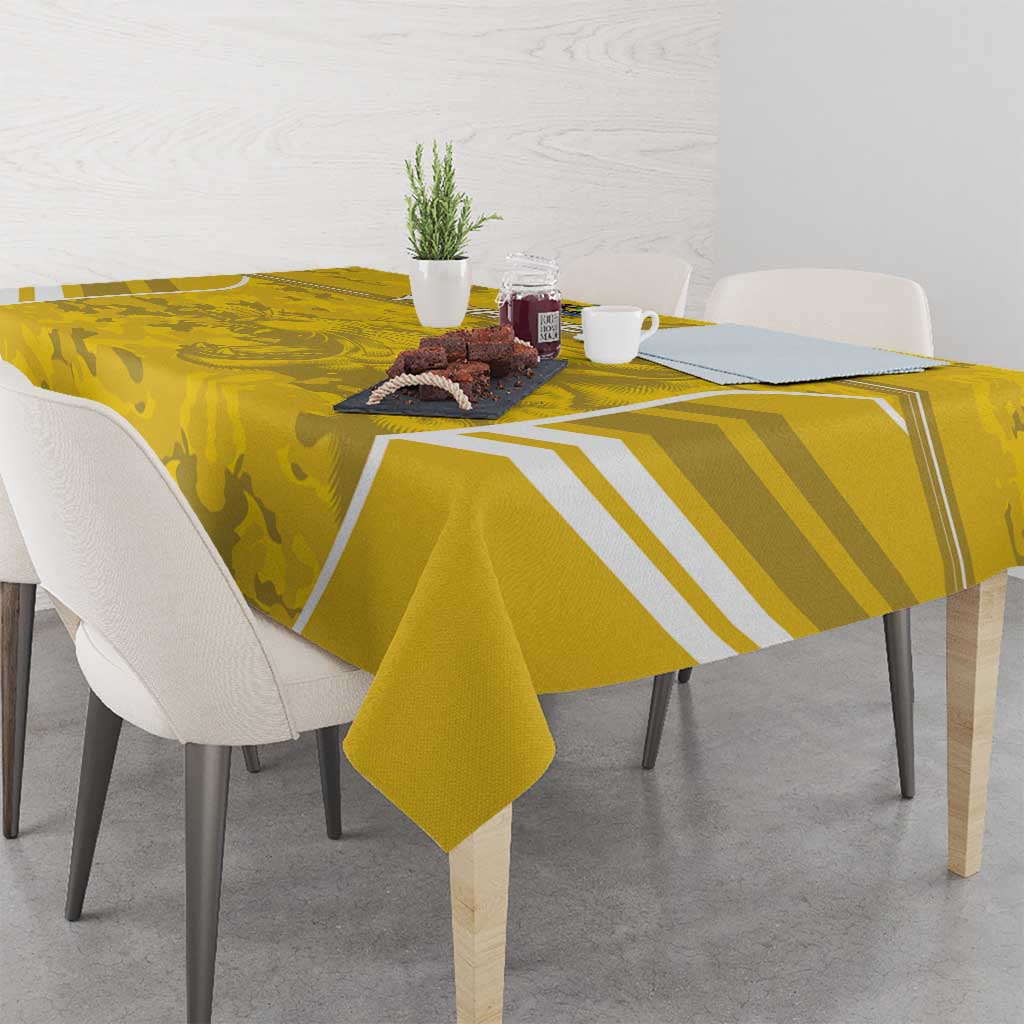 Yellow camo football tablecloth with white geometric stripes draped over table