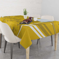 Yellow camo football tablecloth with white geometric stripes draped over table