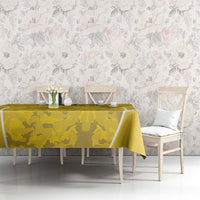 Yellow camo football tablecloth with white diagonal stripes on dining table
