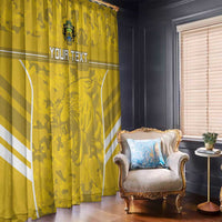 Yellow window curtain panels with camouflage pattern, white stripes, and custom text across center.