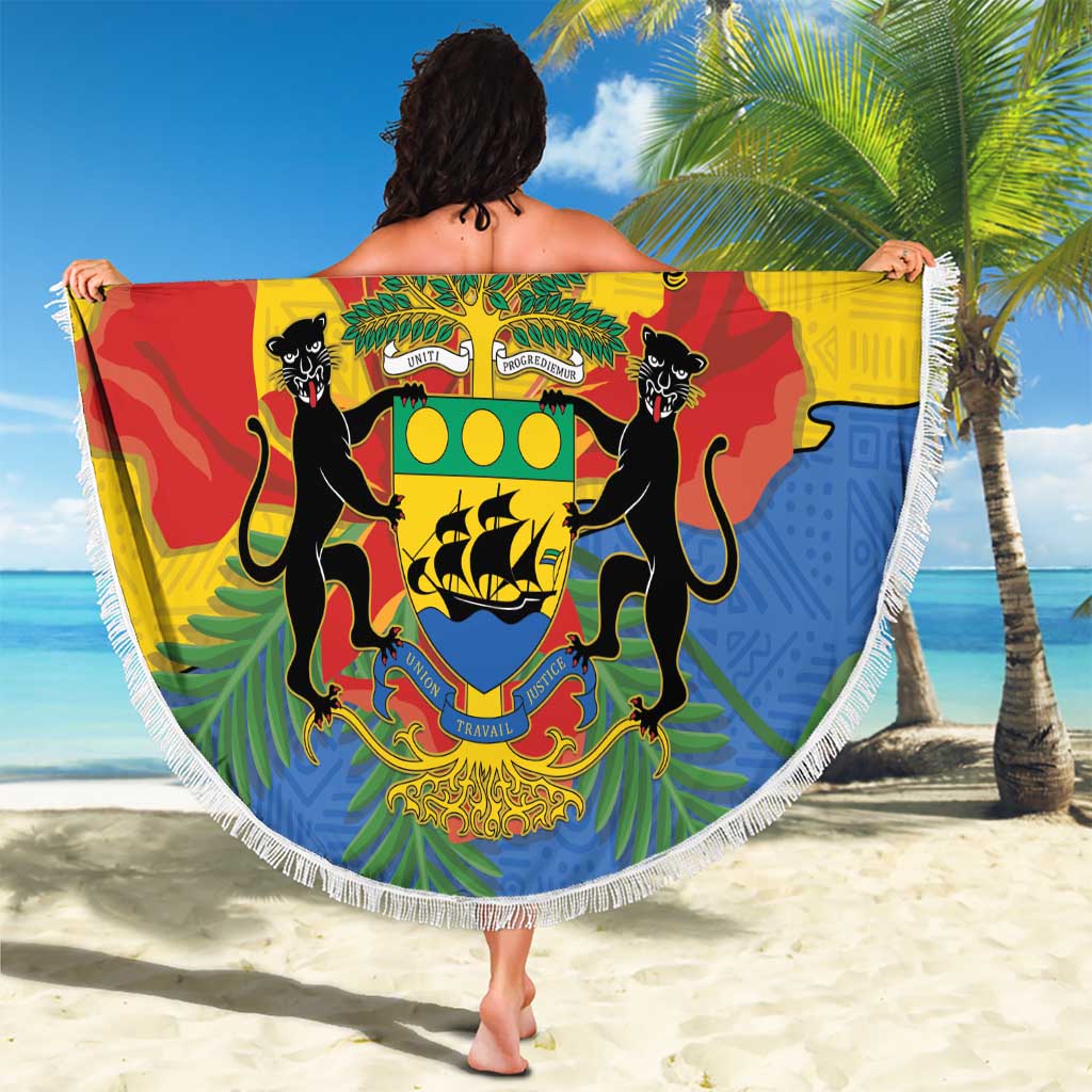 Round green beach blanket with fringe edge held up, Gabon coat of arms and custom text
