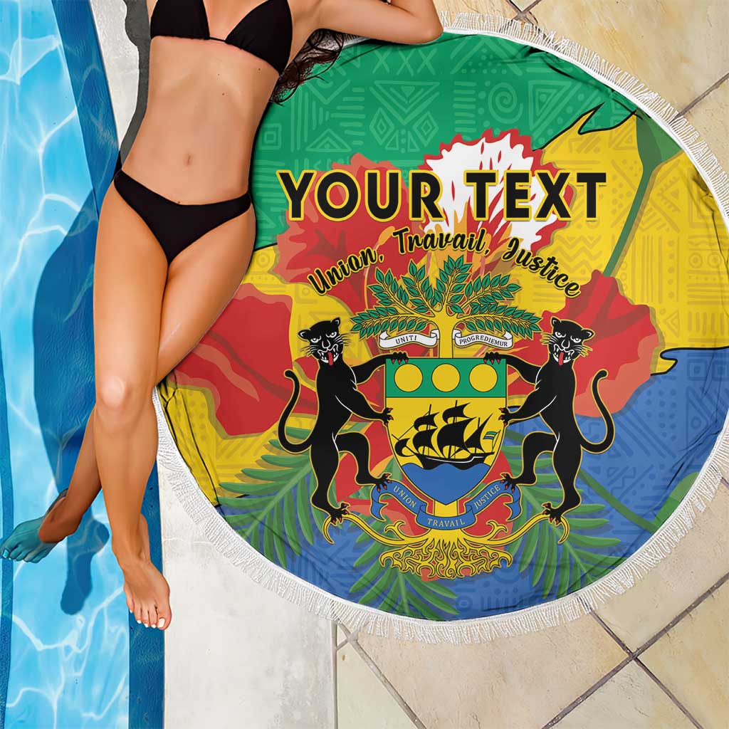 Round green beach blanket with fringe edge over poolside, Gabon coat of arms and custom text
