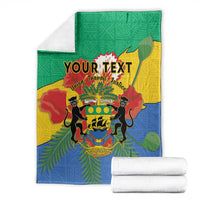 Folded green, yellow and blue personalized blanket coat with coat-of-arms and African pattern