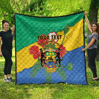 Gabon quilt blanket with quilted texture, green yellow blue panels and 'YOUR TEXT' crest.