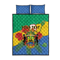 Quilt bed set flat lay with lion coat-of-arms graphic, two blue pillow covers