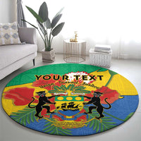 Round area rug with Gabon coat of arms and two lions, multicolor design on green