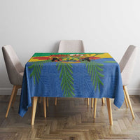 Gabon coat-of-arms tablecloth with African motifs in blue, green, and yellow on dining table