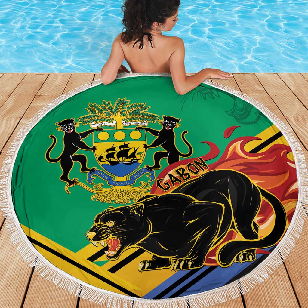 Green round beach blanket with white fringe, Gabon crest and black panther by pool