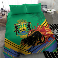Green duvet and pillows with Gabon coat of arms and black panther, striped flame motif