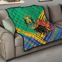Green quilted blanket draped over sofa with Gabon crest and black panther flame stripes