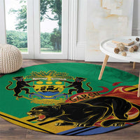 Green round rug with Gabon crest and black panther graphic, bordered edge