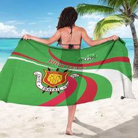 Green personalized sarong coat viewed from back with Burundi crest print