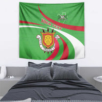 Green tapestry wall hanging with 1962 badge, crest emblem, and red/white diagonal waves