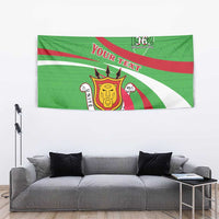Green independence tapestry with crest emblem, “YOUR TEXT,” and red/white curved stripe design