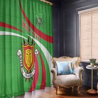Green printed window curtain with Burundi crest and “YOUR TEXT” banner over red/white stripes.