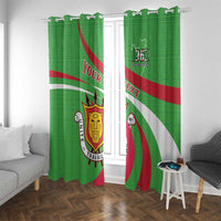 Green printed window curtain panels with hanging rings, Burundi crest, “YOUR TEXT,” and red/white stripes.