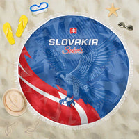 Round Slovakia beach blanket, blue with eagle and red/white stripe, fringed edge.