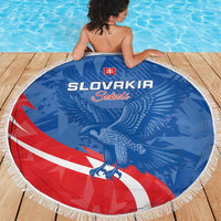 Round Slovakia beach blanket, blue eagle graphic with red/white stripe and fringed border.