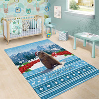 Blue Christmas area rug with marmot, snowy mountains, and Joyeux Noel text