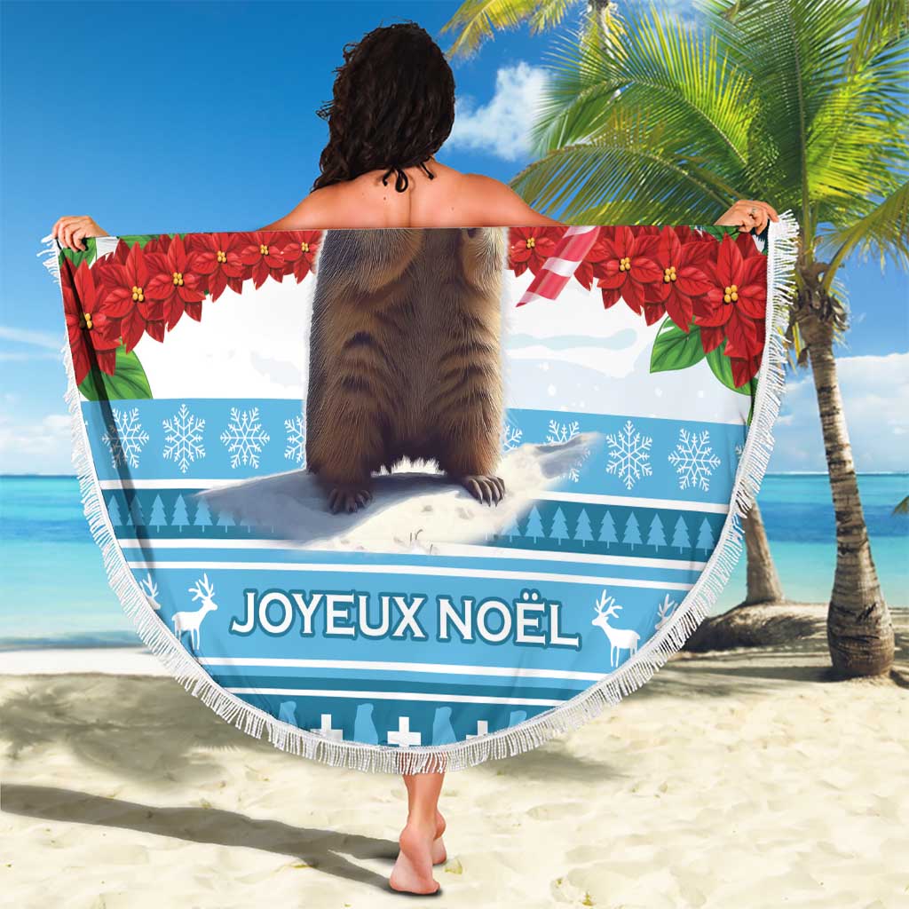 Round blue Christmas beach blanket with marmot graphic and Joyeux Noël text