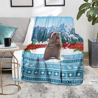 Blue Christmas blanket with marmot, mountains, and Joyeux Noel pattern