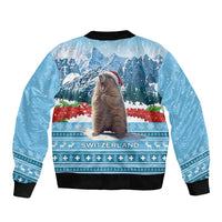 Unisex blue bomber jacket with mountain scenes and marmot graphic, ribbed cuffs