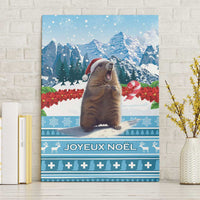 Blue canvas wall art featuring a marmot in a Santa hat with snowy mountains backdrop
