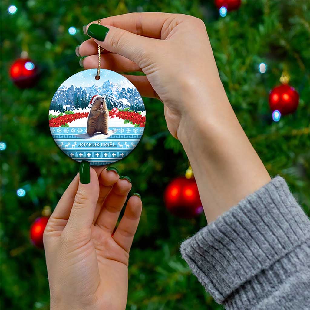 Round ceramic Christmas ornament with marmot and snowy mountain scene