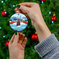 Round ceramic Christmas ornament with marmot and snowy mountain scene