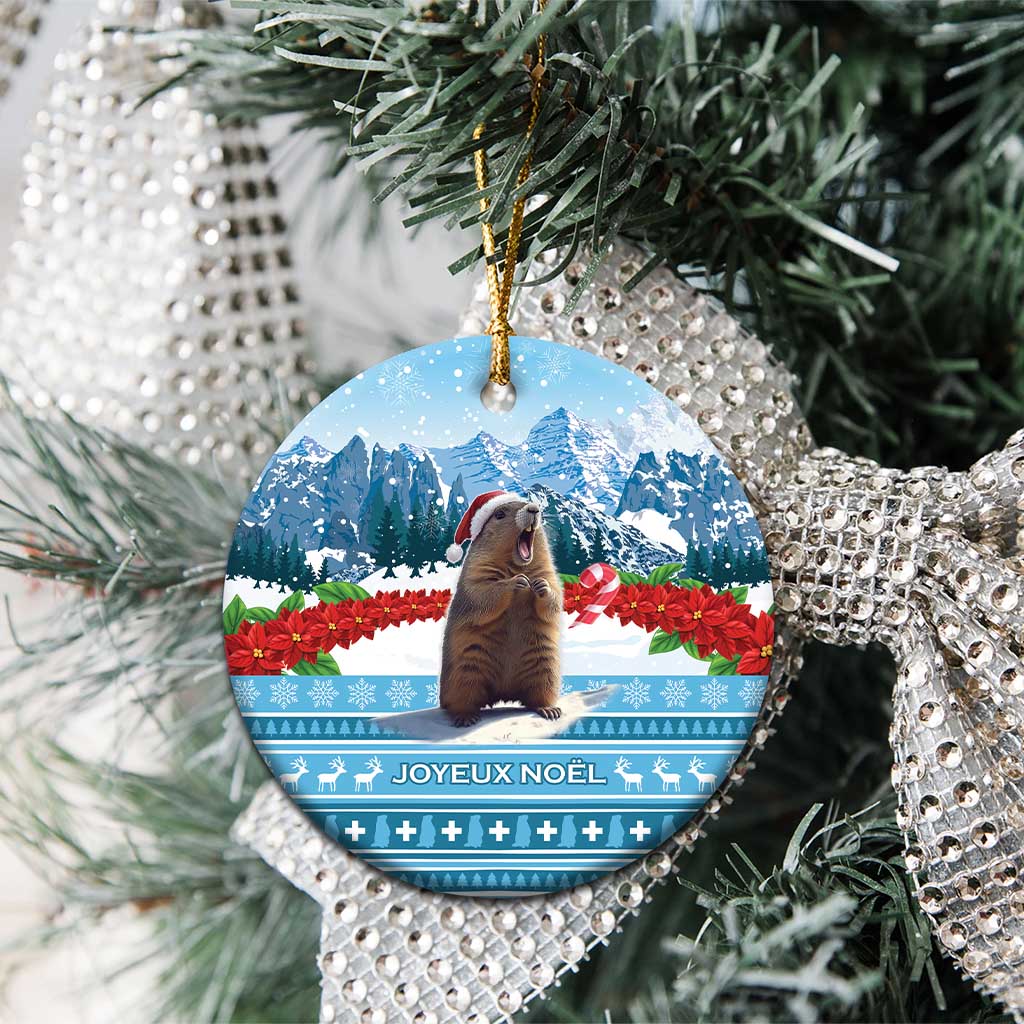 Round ceramic Christmas ornament with marmot, snowy mountains, and JOYEUX NOEL text.