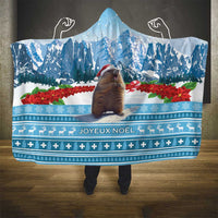 Blue hooded blanket with winter landscape, poinsettias, and Joyeux Noel border pattern
