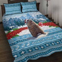 Blue Christmas quilt bed set with marmot, poinsettias, JOYEUX NOEL text, and 2 pillows