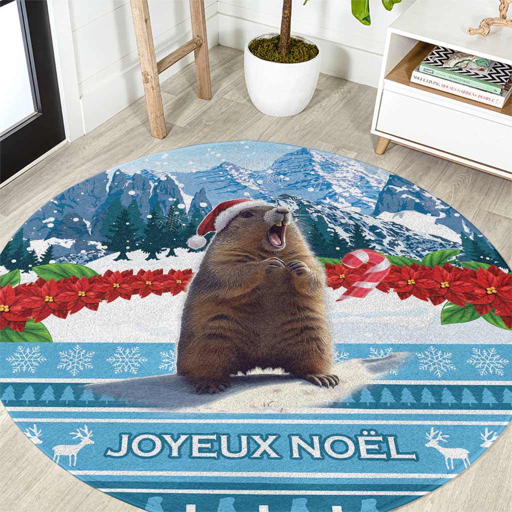 Round blue Christmas area rug with illustrated marmot and "Joyeux Noel" text