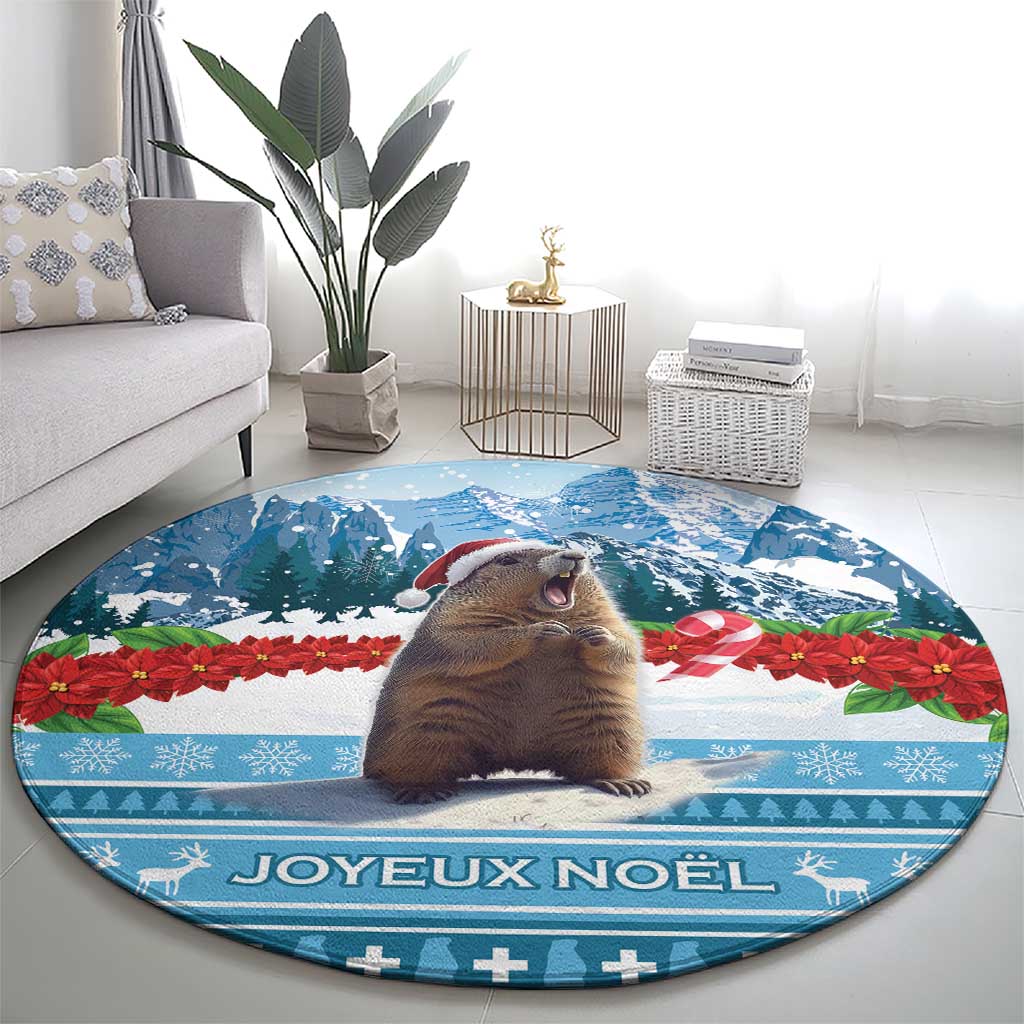Round blue Christmas area rug with marmot in front of trees and "Joyeux Noel" banner