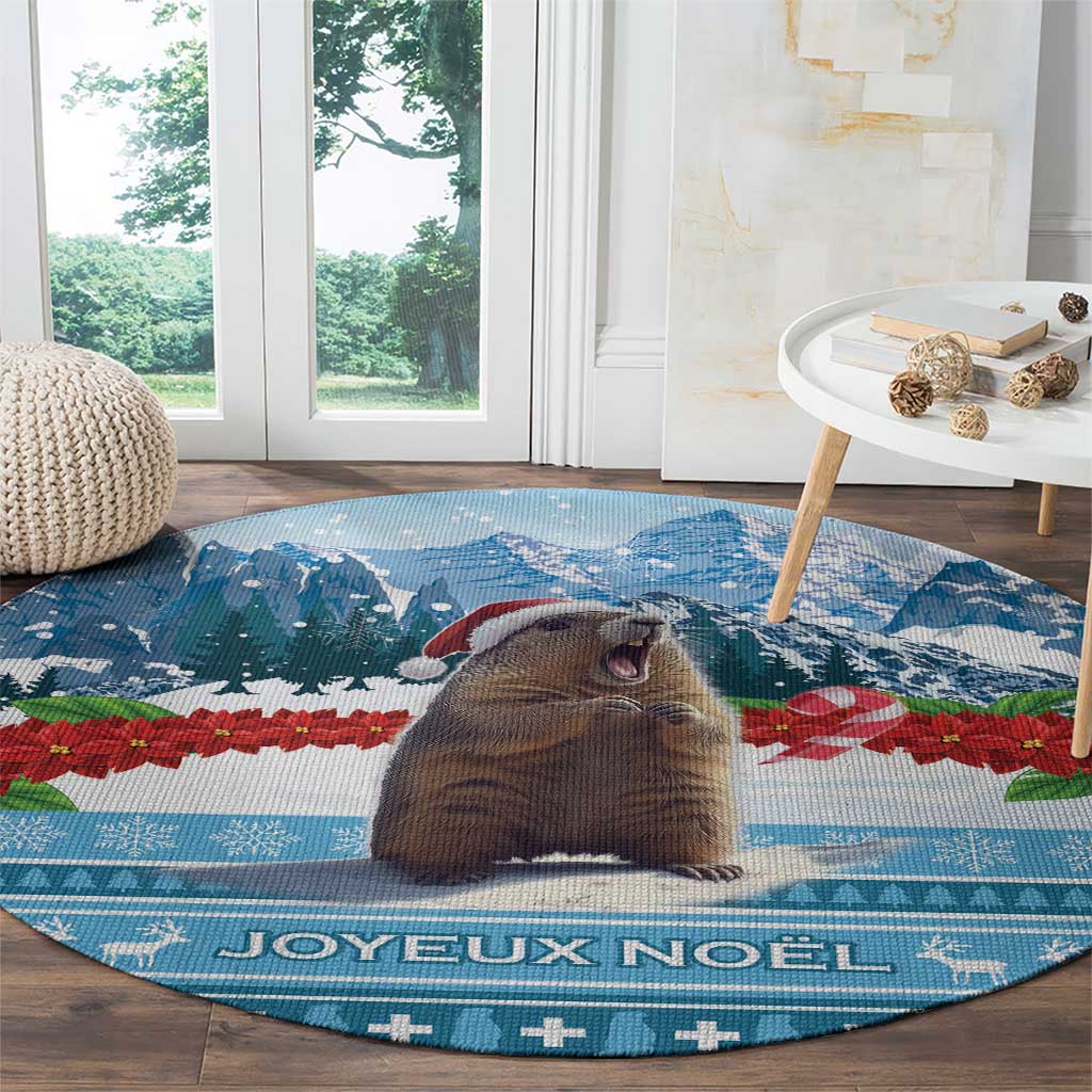 Round blue Christmas area rug with close-up marmot and "Joyeux Noel" lettering