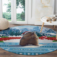 Round blue Christmas area rug with close-up marmot and "Joyeux Noel" lettering